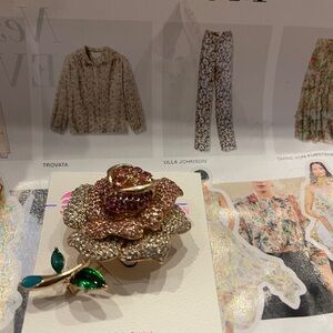 Elegant Rose Brooch with Green Leaf Accents